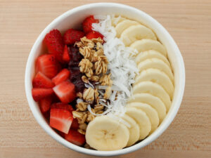 A Acai Bowl on a wooden table from Original ChopShop