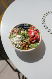 A Berry Chop Salad on a table from Original ChopShop