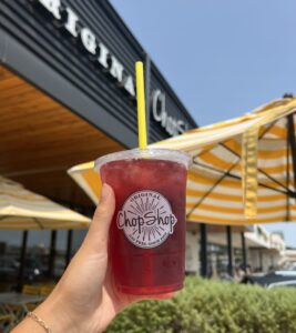 A Seasonal Lemonade positioned in front of a Original ChopShop entrance